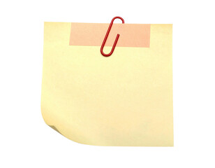 A yellow paper note, affixed with a red paperclip and tape, on a black background