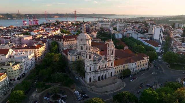 Aerial view of the Estrela Basilica standing tall amidst a cityscape with roads, and a distant bridge, Lisbon, Lisbon, Portugal.
