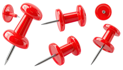 Red pushpins in various angles, showcasing shiny heads and sharp metal tips against black