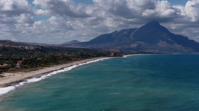 Aerial drone view of Campofelice di Roccella, a charming Sicilian seaside village in northern Sicily, Italy, showing traditional holiday homes, coastline, and panoramic Tyrrhenian Sea vistas