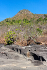 The unusual dark rock formation at the Vale da Lua in Chapada dos Veadeiros near the city of Alto Paraiso, Brazil