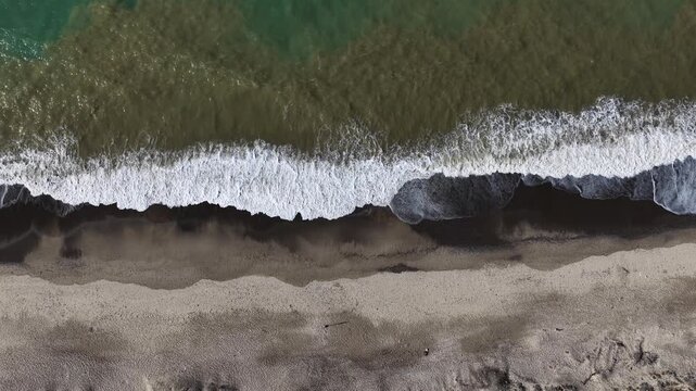 Aerial drone view of Campofelice di Roccella, a charming Sicilian seaside village in northern Sicily, Italy, showing traditional holiday homes, coastline, and panoramic Tyrrhenian Sea vistas