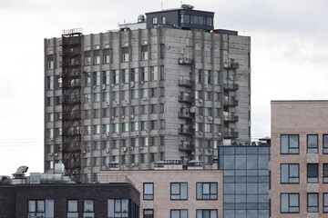 An Old Soviet-Era Research Institute (NII) Building With A Brutalist Architectural Style, Featuring Concrete Panels And External Fire Escapes.