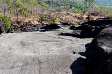 The unusual dark rock formation at the Vale da Lua in Chapada dos Veadeiros near the city of Alto Paraiso, Brazil
