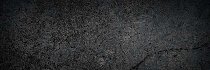 Texture of old cracked concrete wall. Rough dark gray concrete surface with spots, cracks, noise...