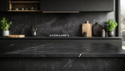 The image shows a black marble countertop in a modern kitchen with dark cabinetry and a blurred background of kitchen utensils and plants.