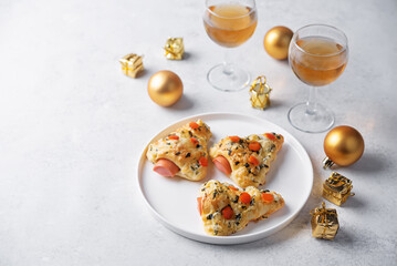 Basil cheese garlic sausage Puff pastry pies in the form of Christmas tree for Christmas holidays