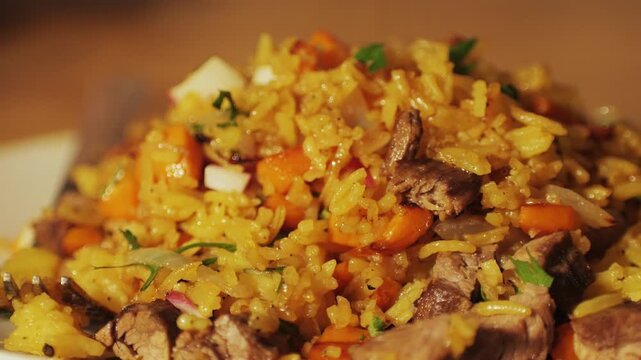 Authentic Chinese and Asian fried rice with egg and vegetables in wok top view on rustic concrete table background. Traditional dish of China with space for text