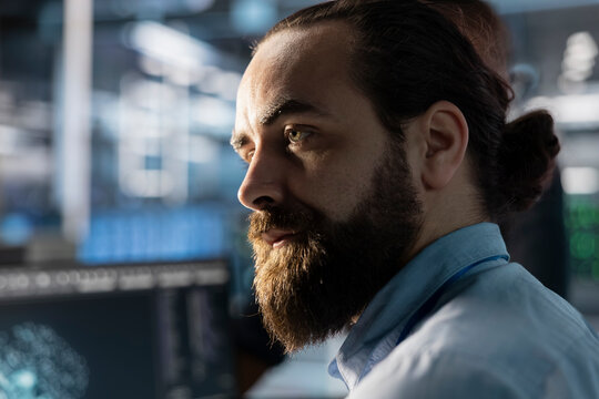 Data center admin doing software updates, verifying neural network parameters in workplace. Close up of server hub IT specialist inspecting configurations, ensuring optimal application performance