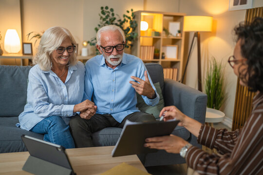 Senior couple engaged in negotiations with a consultant or agent