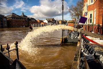 Water being pumped back into the River Ouse in York after buildings along the water front have been...