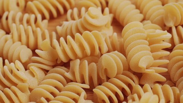 Pasta mix, different Italian tagliatelle fussili pasta packaging window, Fettuccine pasta, close up, not cooked
