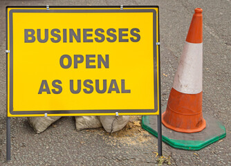 An information sign indicating that businesses in the area are still open despite the roadworks.