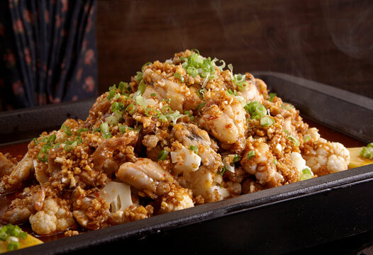 Wok-fried frog meat with garlic and cauliflower, Close-up