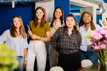 Full-body portrait of a group of professionals modeling together