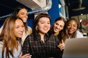 A group of women collaborating in a cooperative work atmosphere
