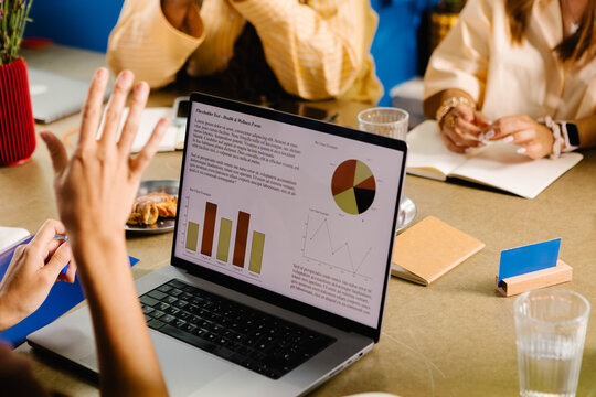 Close-up of laptop screen displaying a report from a creative company