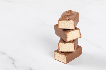 Chocolate candy. Caramel Souffle In chocolate. White background. Copy space