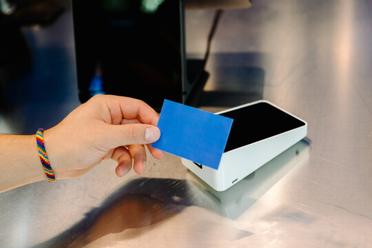 Unknown person using a contactless credit card to make a payment