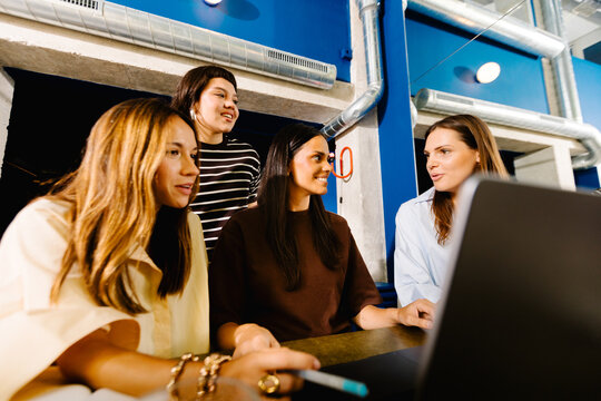 Creative female employees working in a collaborative environment