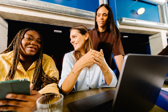 Female entrepreneurs chatting during a collaborative work meeting