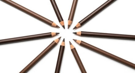 Assorted brown eyeliners in symmetrical circular arrangement for beauty and fashion