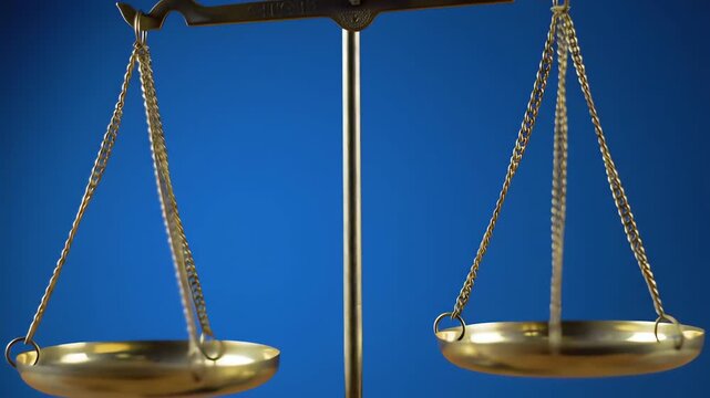 A close-up view of a classic golden balance scale tipping slowly symbolizing injustice and weighing options