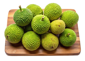 A bountiful harvest of fresh green breadfruit arranged artfully on a wooden board isolated on transparent background