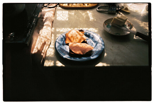 Homemade sandwiches on a plate by the window