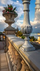Fototapeta premium Balustrade on terrace, overlooking the water with flowerpot
