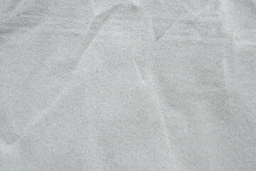 Obraz premium Light Gray Textured Fabric Background with Subtle Creases and Soft Natural Feel for Design and Textile Applications