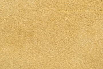Textured background of smooth yellow surface perfect for design projects, wallpapers, or artistic compositions