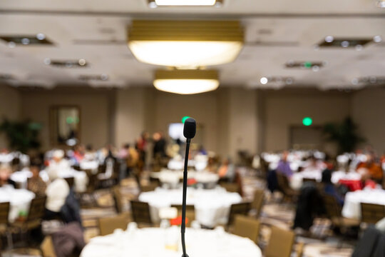 Microphone in front of a room at the beginning of an event