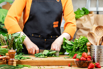 private chef is busy preparing healthy food in colorful kitchen