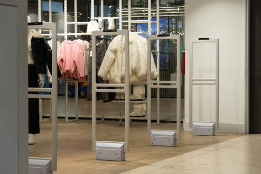 Radio-frequency security gates with integrated metal detector at a clothing store entrance