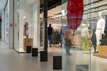 Radio-frequency security gates with integrated metal detector at a clothing store entrance