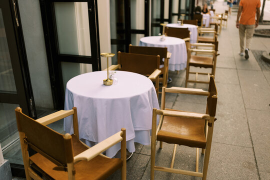 Outdoor Dining Setup at a Cafe With Tables and Chairs