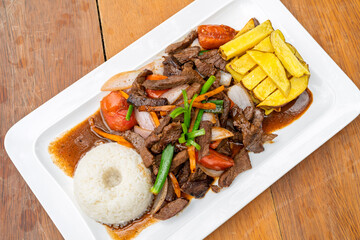 Lomo saltado, classic peruvian stir fry beef dish
