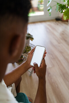 Man checking phone indoors