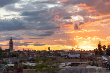 Sunset over Marrakesh rooftops and Koutoubia Mosque
