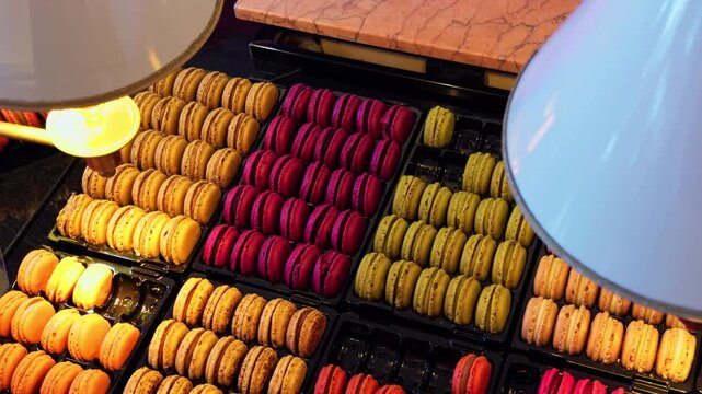 A Colorful and Tempting Display of Delicious Macarons at a Charming Patisserie to Satisfy Your Sweet Tooth