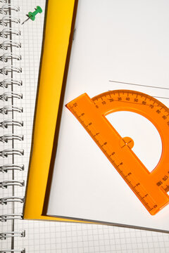 Study Tools Still Life With a Protractor and Notebooks. 