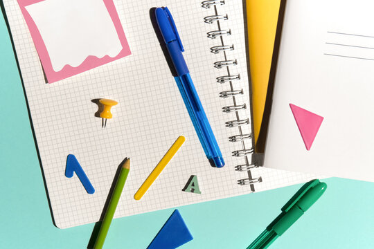 Colorful Flat Lay with Stationery Items. Blank Pages with Copy Space.