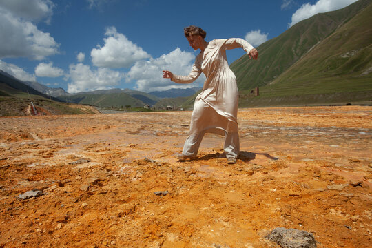 A woman in the beige dress in Truso valley 