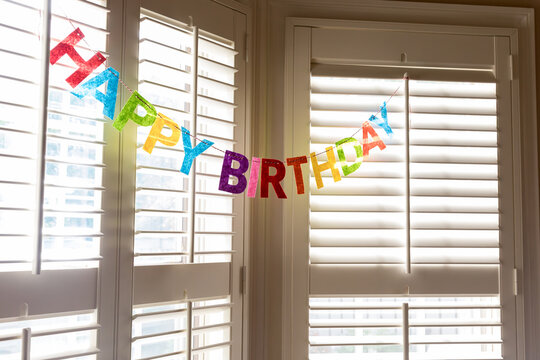 Happy Birthday Garland Displayed in a Window