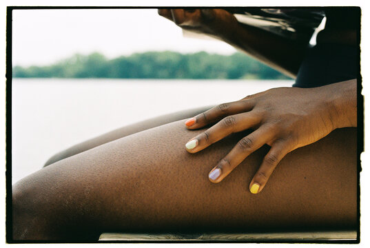 Relaxing by the Water With Painted Nails During Summer Afternoon