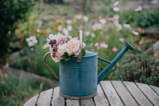 Watering Can with Flowers Inside