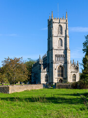Saint Mary's Church Steeple Ashton. Mid shot.  Pretty country church surrounded by fields