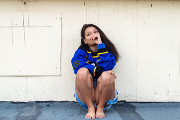 Beautiful brunette distracted showing her lingerie and out of the house