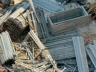 Construction Scaffolding and Metal Components at a Building Site